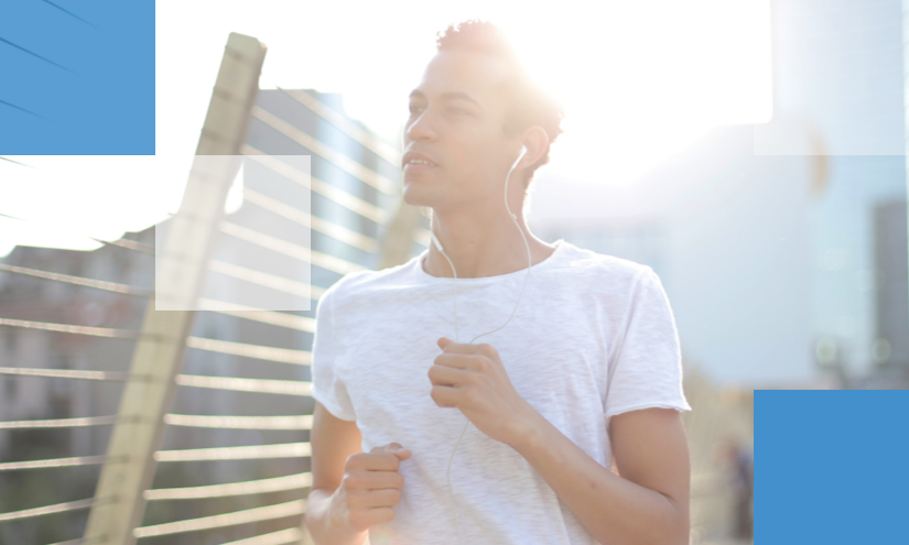 A man jogging, with earphones in